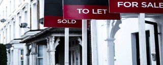 for sale signs outside houses