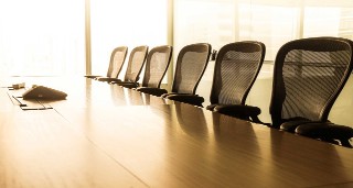 seats at a board room table