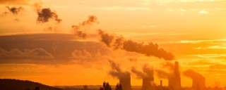 factory chimneys at sunset